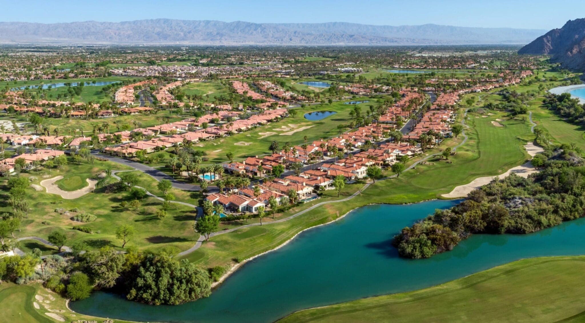 Aerial view of golf course and homes.